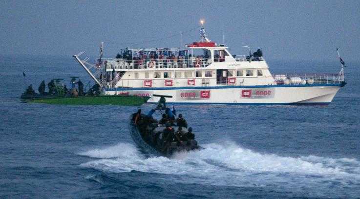 Israeli troops approach one of the 2010 Freedom Flotilla boats