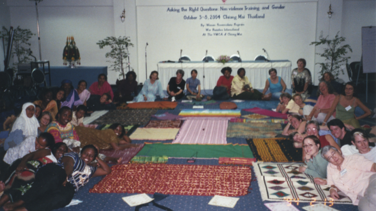 A group of people attending a nonviolence training focusing on gender