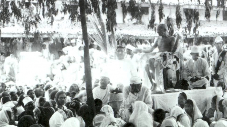 Gandhi gives a talk to a crowd